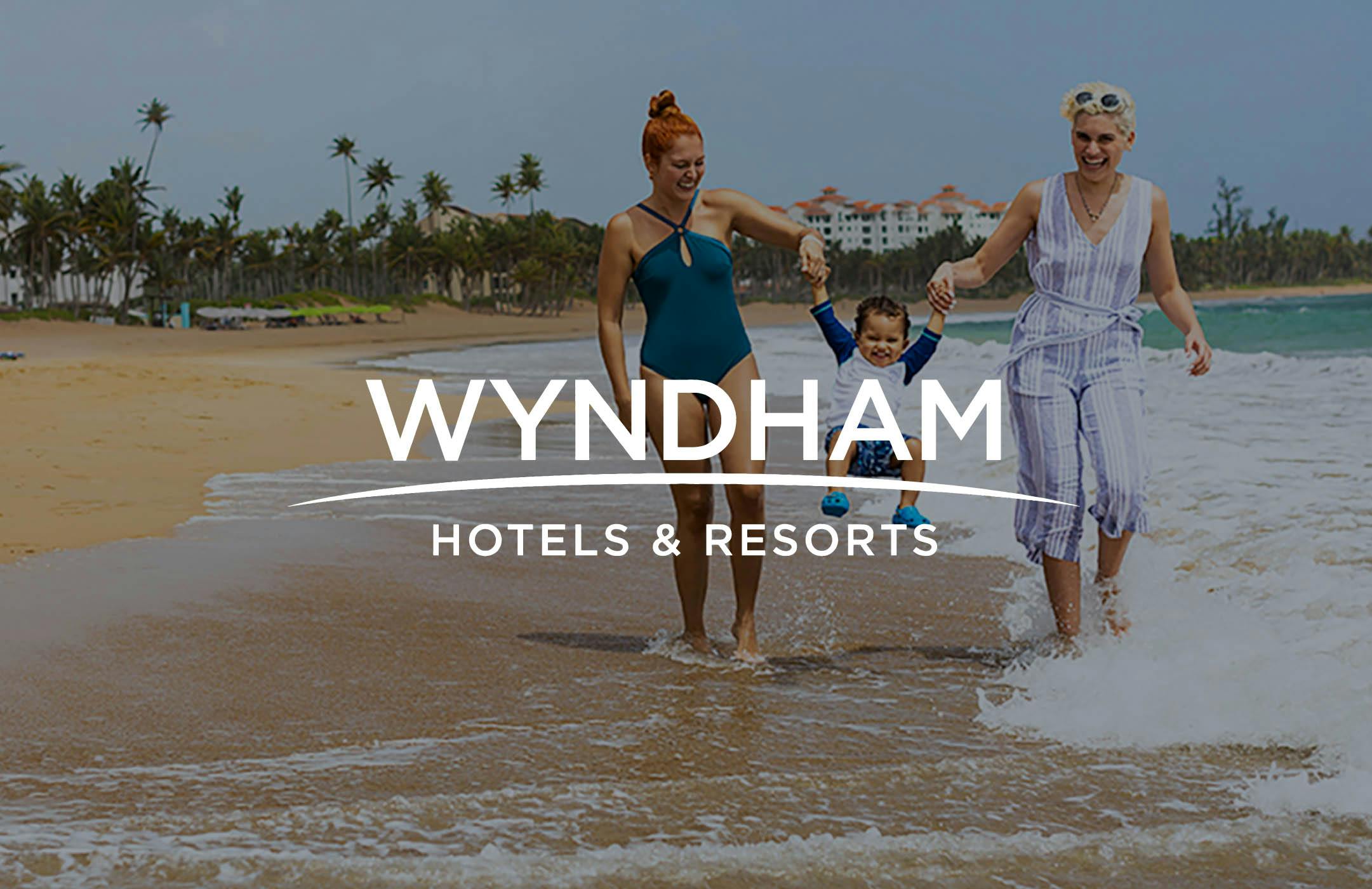 Wyndham Hotels & Resorts logo against image of resort