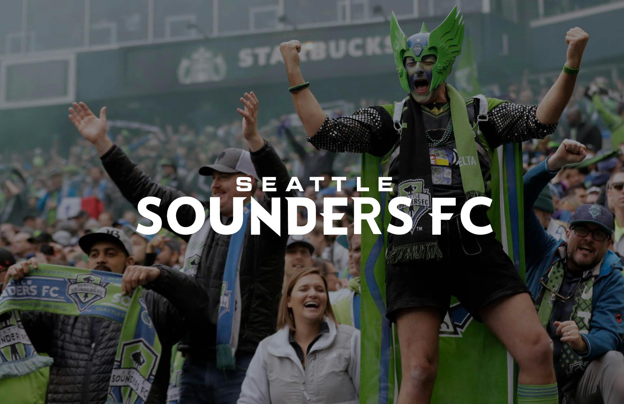 Image of Sounders fan standing up with arms up with text: Seattle Sounders FC